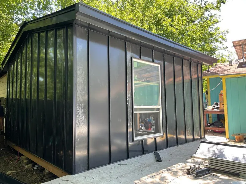 Black standing seam metal wall panels for Metal Roof Installation in Hutchinson